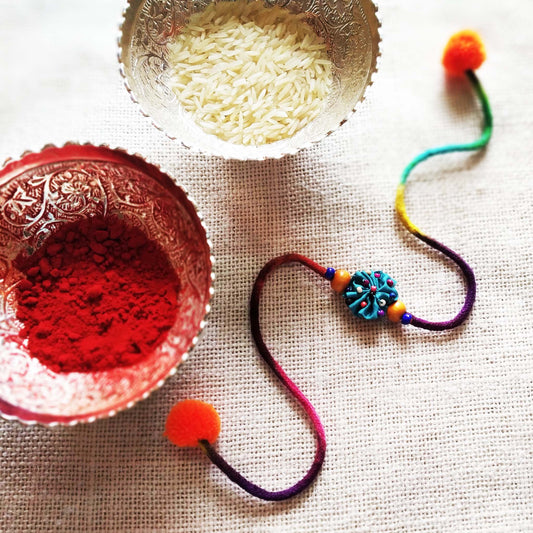 Turquoise Flower Rakhi