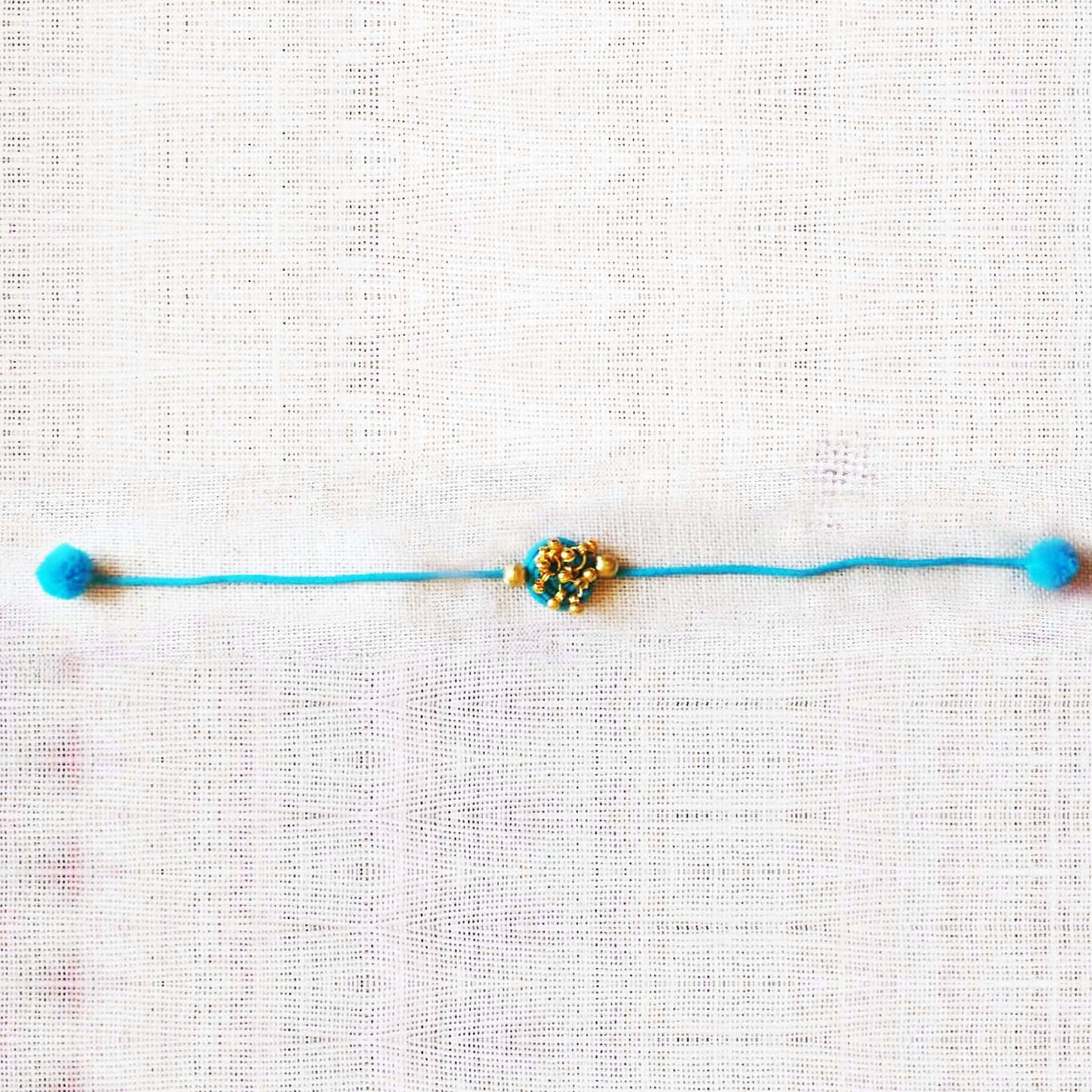 Turquoise Gold Rakhi