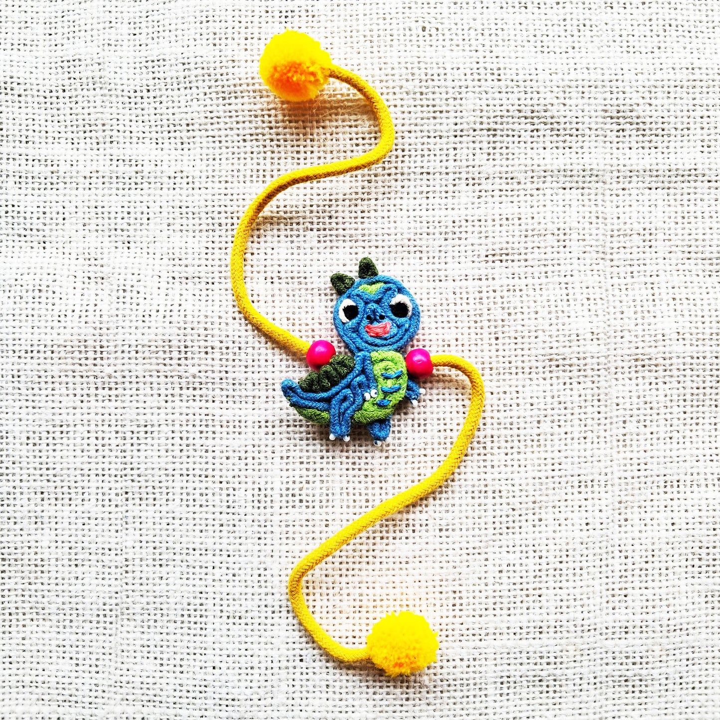 Teal Dino Rakhi