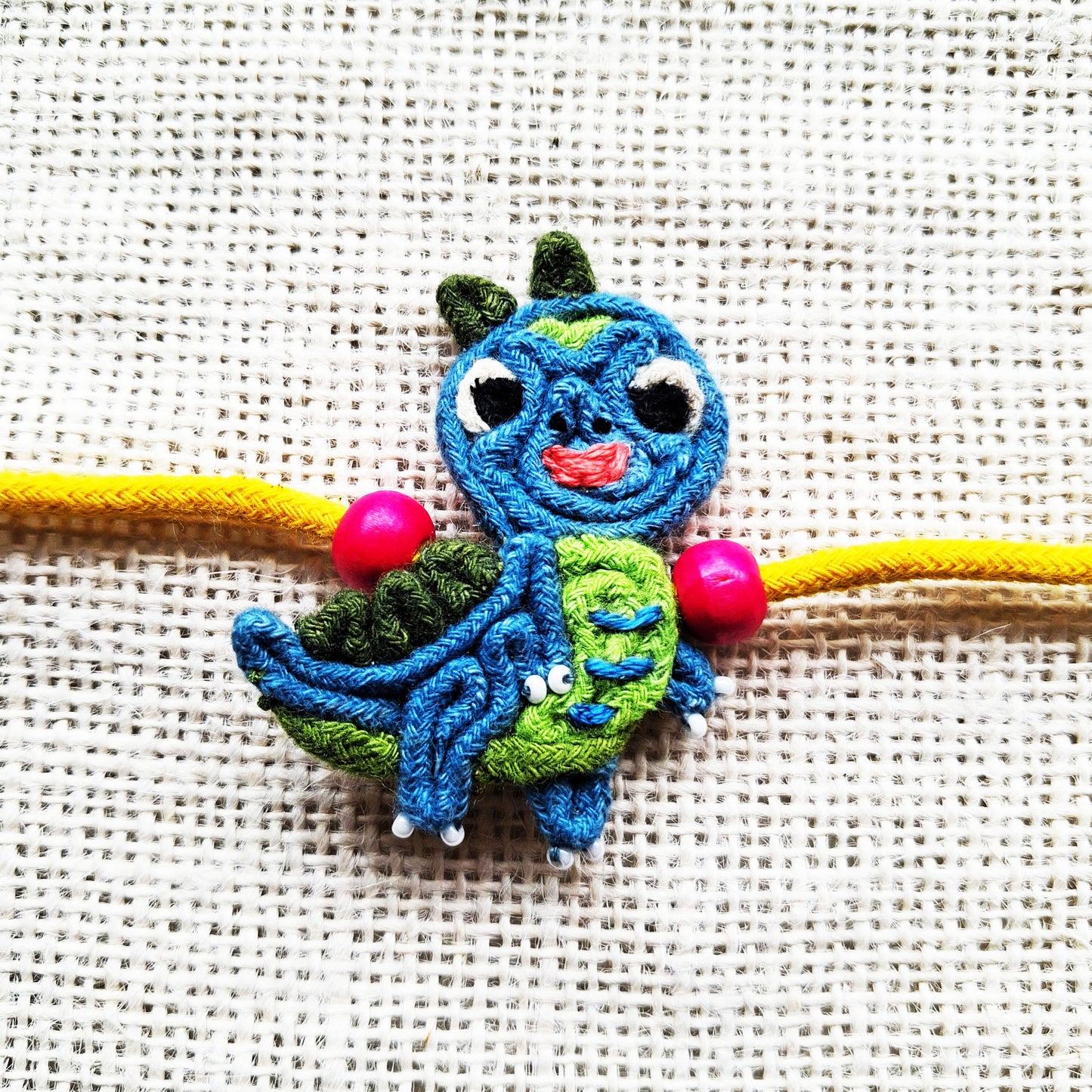 Teal Dino Rakhi