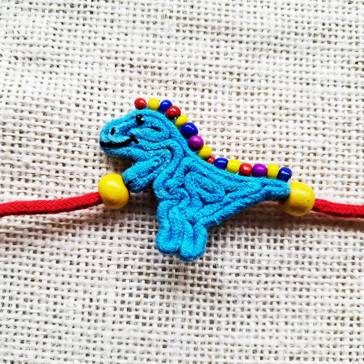 Playful Dino Rakhi